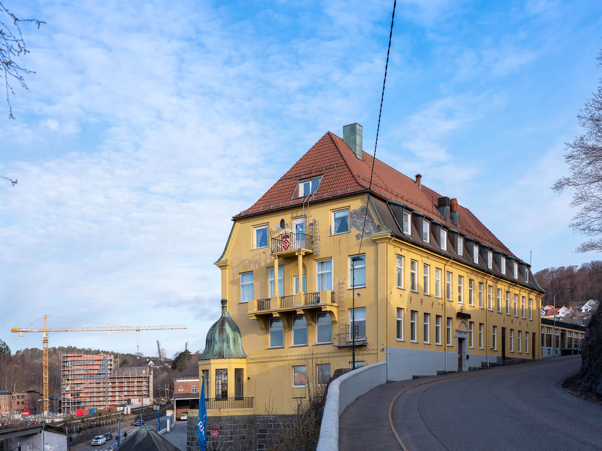 The yellow Farris building with its tower, in winter light